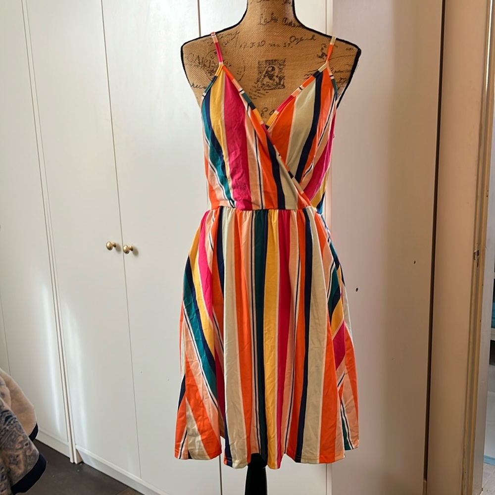Striped dress so colorful and pretty. Dress has adjustable straps.Size medium
